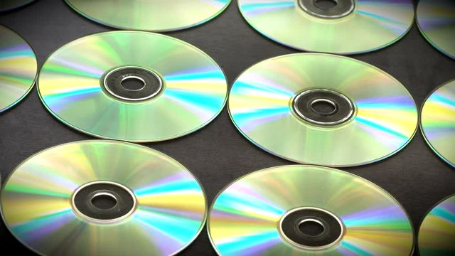 Slow Motion Arranged in Rows of cd or Dvds Disks