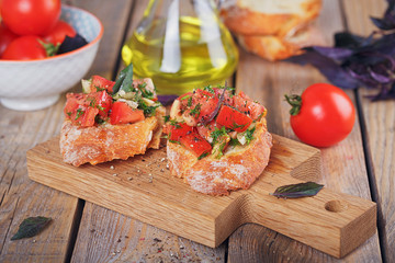 Bruschetta with chopped tomatoes, basil and herbs on grilled crusty bread.