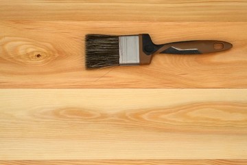 Brush for painting on a wooden board