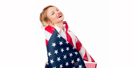 Smiling patriotic woman with United States flag. USA celebrate 4th July.