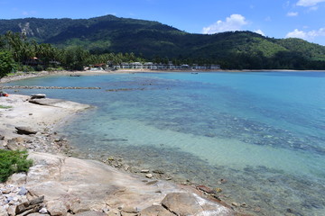 Sea view with pebble stone beach and fantastic blue sky in Thailand