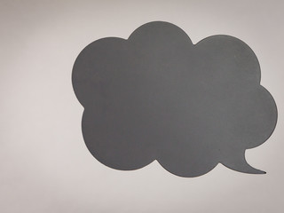 Woman hand pointing at black speech bubble