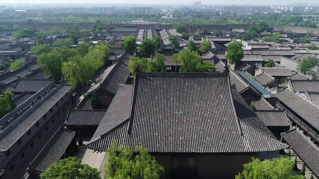 Aerial view on Confucian Temple in the Ancient city of Pingyao, a UNESCO world heritage site in China-part 1 of a 2 part series which can be merged to a continuous movie