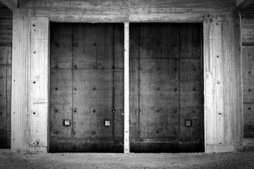 Empty concrete elevator shaft in abandoned building. Black and white. © Srdjan