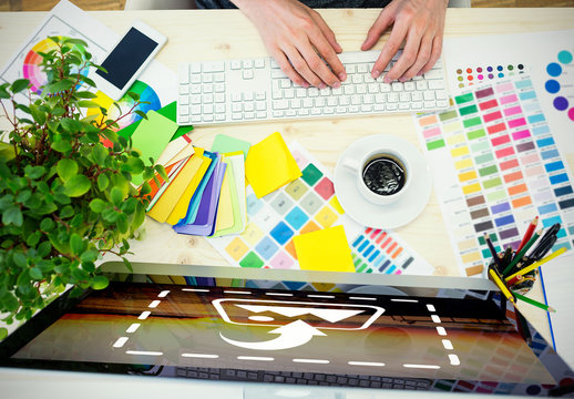 User with Computer, Smartphone, and Paint Swatches Mockup 1