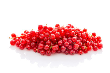 bunch ripe red currant isolated on white.
