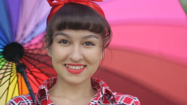 Beautiful lady in the style of a pinap with an umbrella