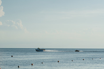 The boat rolls, pulls a banana ride AO sea