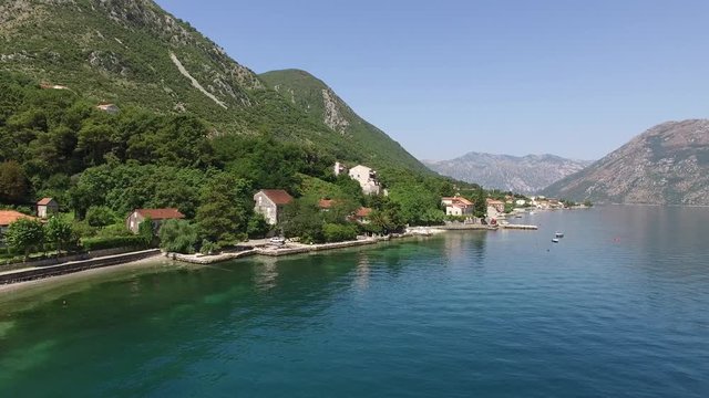 Land for sale in Montenegro. Hotel by the sea. The town of Prcanj in the Bay of Kotor. Property on the sea. Uninhabited land. Montenegro. Aerial photography.