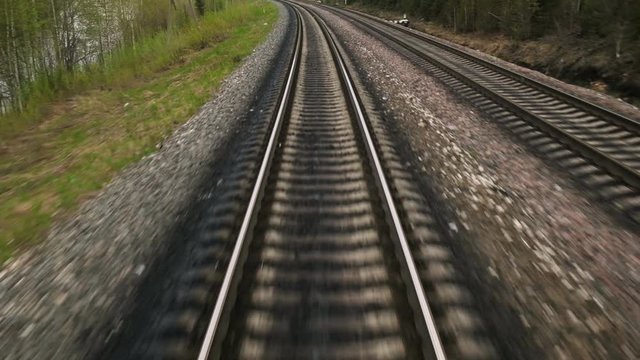 Railroad tracks while the train travels fast. The length of the railway track