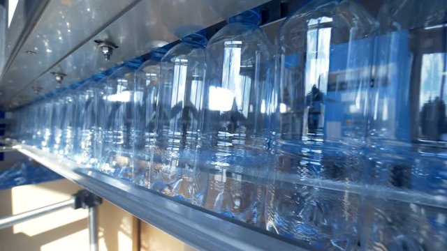 Several PET bottles in close batch on factory. 