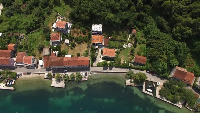 Land for sale in Montenegro. Hotel by the sea. The town of Prcanj in the Bay of Kotor. Property on the sea. Uninhabited land. Montenegro. Aerial photography.