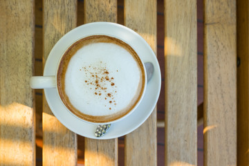 Top view of hot cappuccino coffee cup.