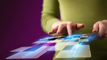 Close up of hand holding tablet with cyber application