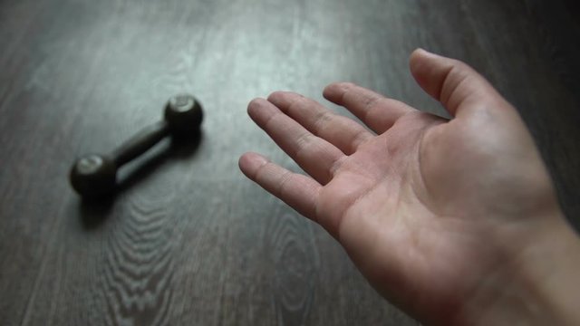 Kettlebell Falling From the Hand Failure Concept
