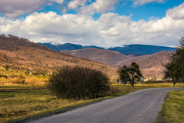 countryside road through valley to village