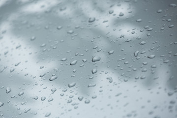 rain drops on car with glass coating protection skin