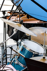musical kit of drums with cymbals in the street ready for performance