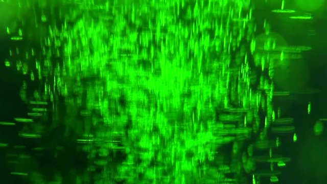 Liquid is bright green in a glass chemical flask: texture and processes of venturi. In vitro: liquid in chemical container extra close-up. Concept chemistry, laboratory, chemical liquids.
