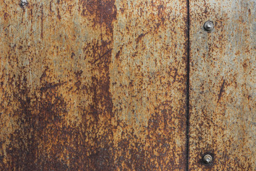 Rusty metal plate texture with bolts