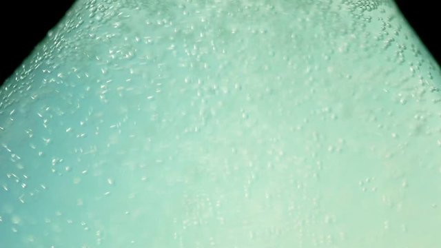 The liquid is turbid white in the glass chemical flask: the texture and processes of the venturi. In vitro: white opaque liquid in a chemical container extra close-up. Concept chemistry