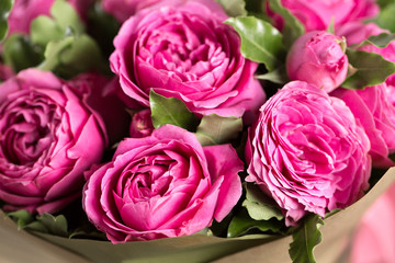Fototapeta na wymiar Pink peony roses in vase. retro styled photo.