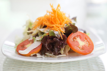 small mixed salad with carrot and tomato
