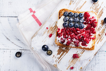 Toast with cream cheese and berries