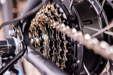 Obraz premium close up of bicycle gear and black electric motor