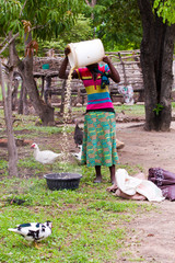 African woman preparing meal for family in the village