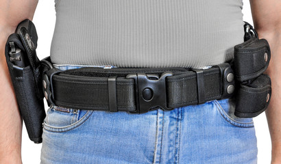 Military tactical belt with semi-automatic buckle for connection with cartridge pouch, placed on...