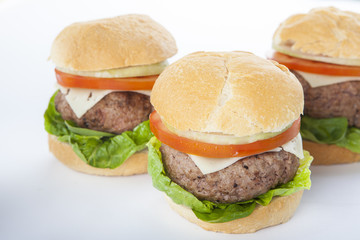 Giant homemade burger classic american cheeseburger isolated on white
