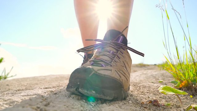 Hiking shoes - woman tying shoe laces