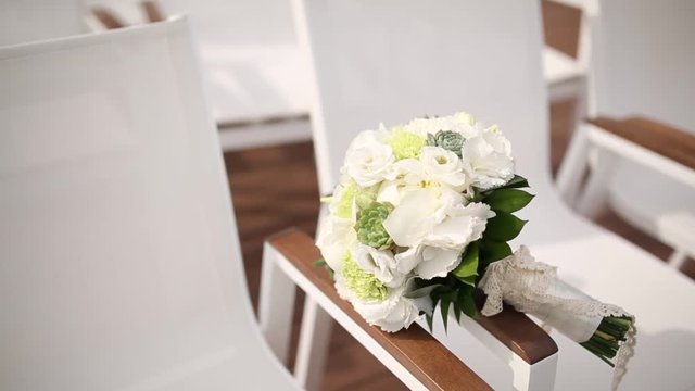 Bridal bouquet of roses and eucalyptus on a table. Wedding in Montenegro.