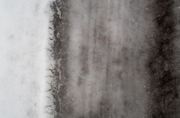 winter melting snow dark gray background