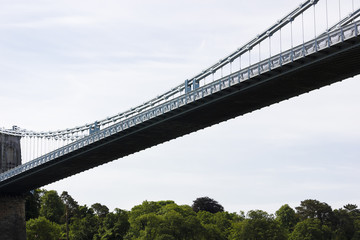 View of the Menai Suspension Bridge's colossal steel chains holding up the central section of steel decking, Anglesey, North Wales