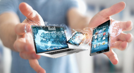 Businessman connecting tech devices to each other 3D rendering