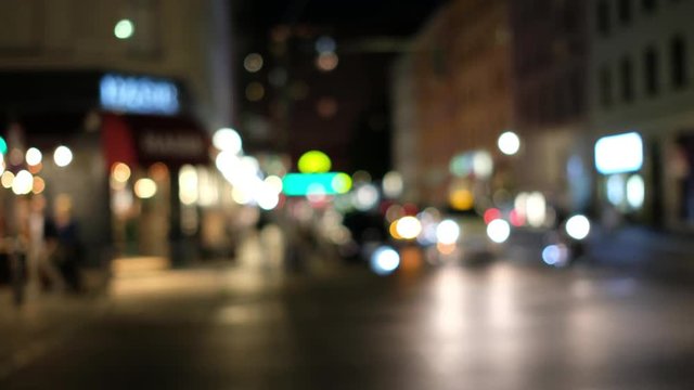  cars driving on busy street  at night - bokeh light of city traffic