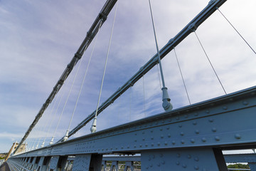 Artistic view of the steel chains and cables of the historic Menai Suspension Bridge, Isle of Anglesey, North Wales