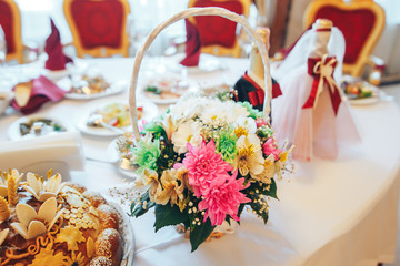 a beautiful gift basket with flowers on the table