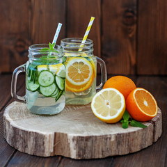 A drink of lemon, cucumber, orange and mint. Detox water. Citrus fruits. The concept of a diet, a vegetarian, healthy food and a lifestyle.