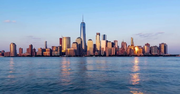 New York City Financial District skyscrapers and Hudson River. Timelapse from sunset to twilight. Lower Manhattan