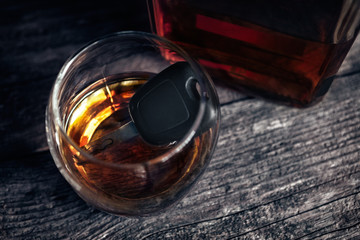 Car keys in glass of alcohol drink