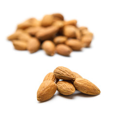 Closeup of almonds, isolated on the white background