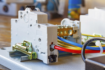 Automatic circuit breaker installed on a DIN-rail