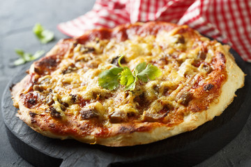Pizza with baked meat and chili sauce