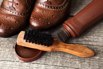 Brush,shoe cream and pair of shoes