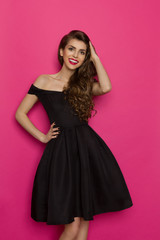 Smiling Elegant Woman In Black Cocktail Dress