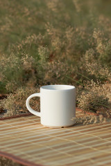 Coffee cup with small flower grass
