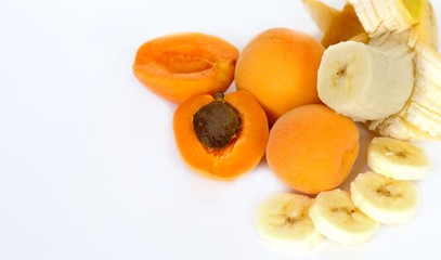 Fototapeta na wymiar Apricot and banana on white background